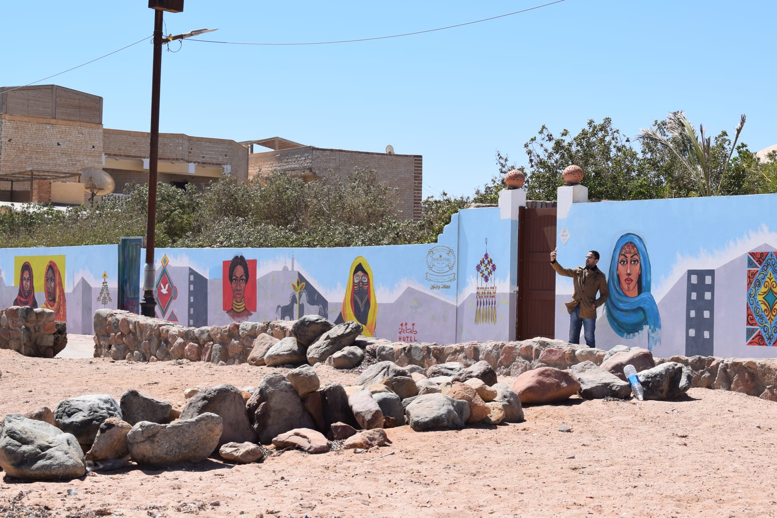 A colorful painted mural along a street in Dahab