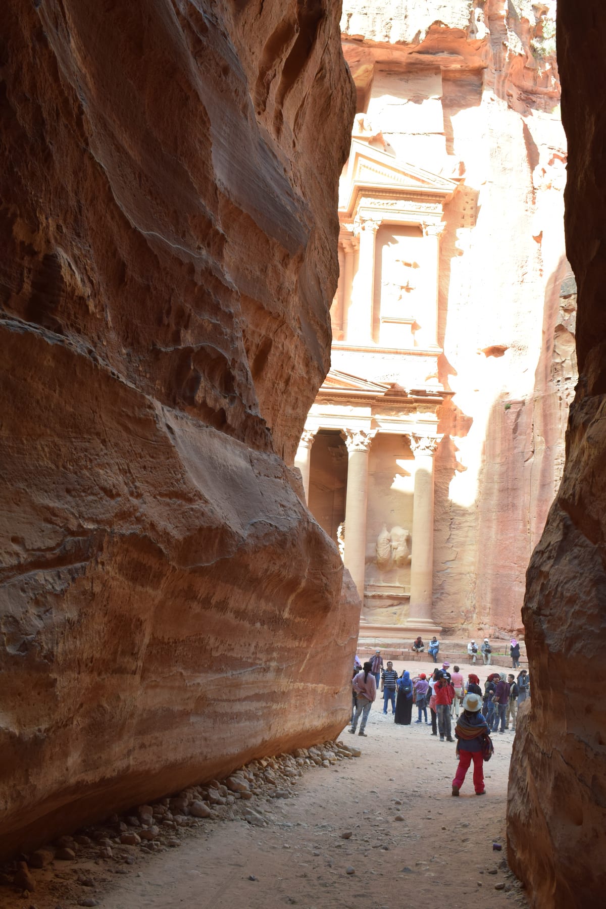 The Treasury at Petra glimpsed through the narrow Siq canyon