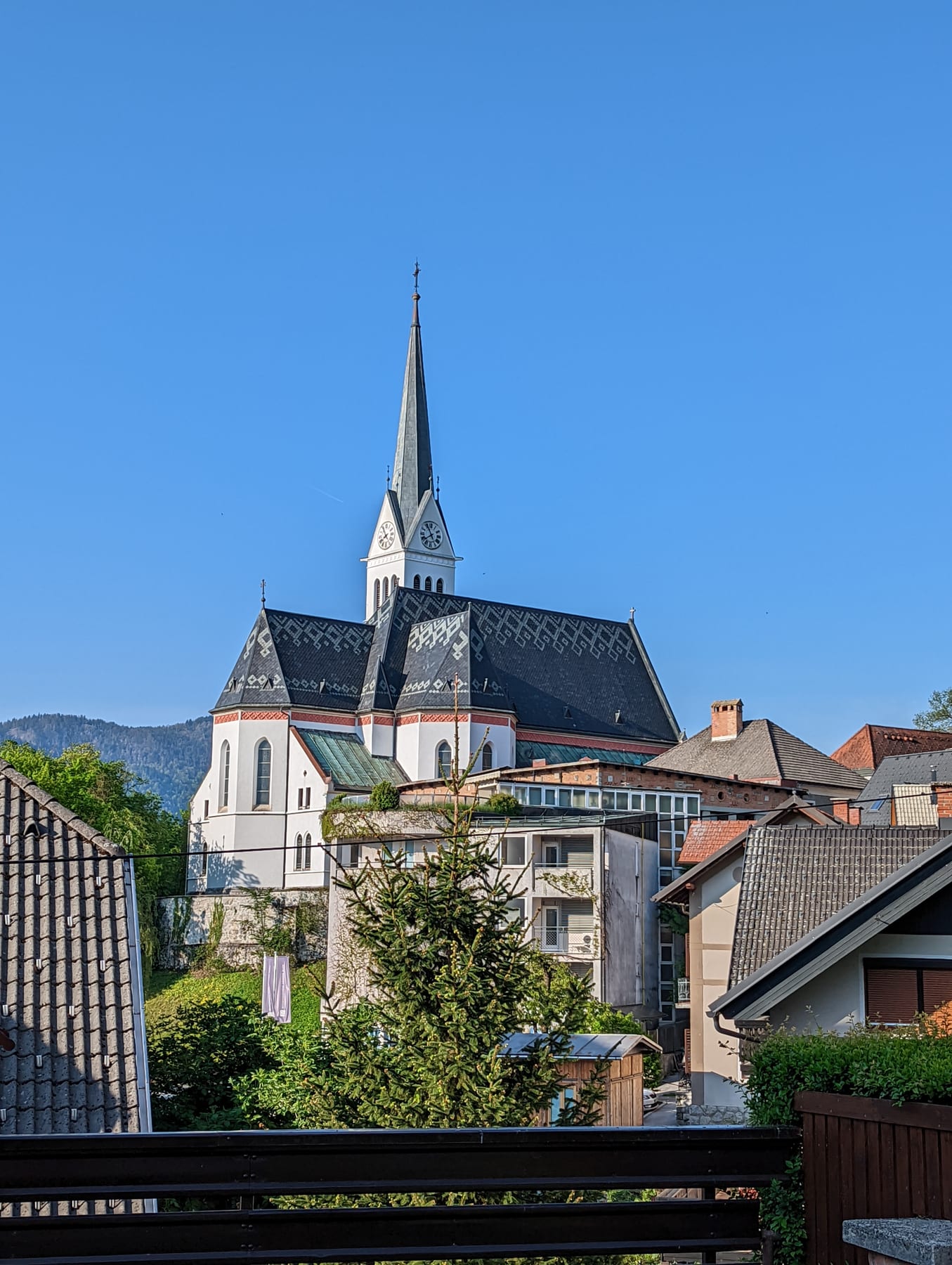 St Martin Parish Church above Lake Bled with the mountains behind it